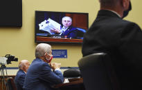 Rep. Steve Scalise, R-La., is seen on a monitor as he holds up a stack of safety regulation documents as Dr. Anthony Fauci, director of the National Institute for Allergy and Infectious Diseases, Dr. Robert Redfield, director of the Centers for Disease Control and Prevention (CDC), left, and Adm. Brett Giroir, Assistant Secretary of Health and Human Services for Health, testify before a House Subcommittee on the Coronavirus Crisis hearing on a national plan to contain the COVID-19 pandemic, on Capitol Hill in Washington, DC on Friday, July 31, 2020. (Kevin Dietsch/Pool via AP)