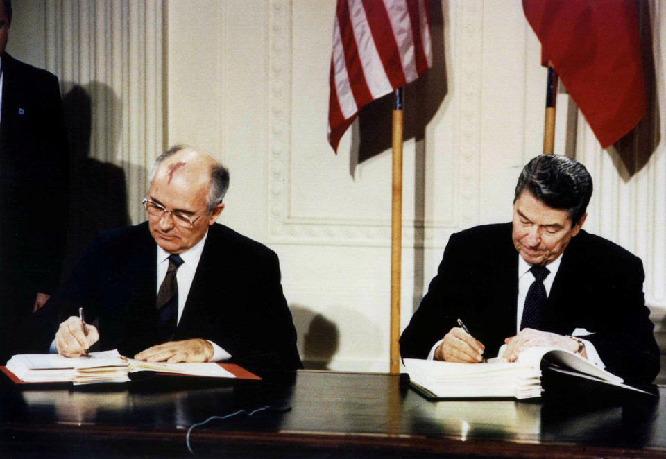 Late U.S. President Ronald Reagan (R) and former Soviet leader Mikhail Gorbachev sign the Intermediate-Range Nuclear Forces (INF) treaty in the White House, December 8, 1987.