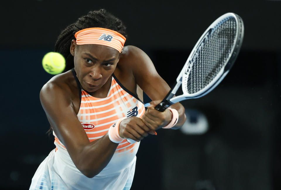 United States' Coco Gauff makes a backhand return to Ukraine's Elina Svitolina during their second round match at the Australian Open tennis championship in Melbourne, Australia, Thursday, Feb. 11, 2021.(AP Photo/Rick Rycroft))