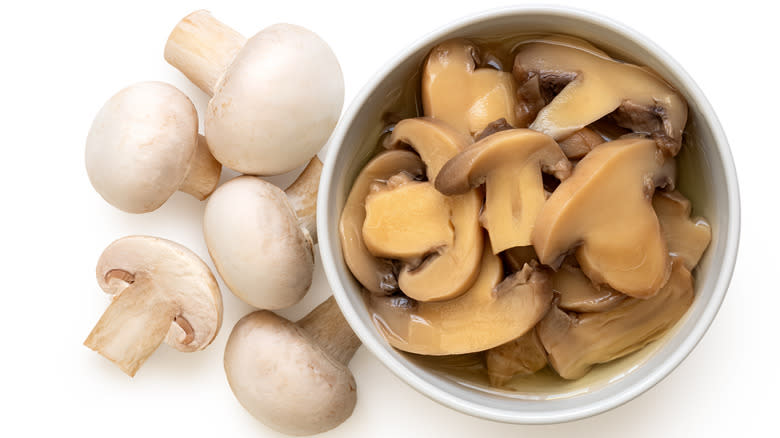 Canned mushrooms in white background