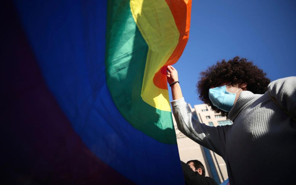 Students of the Bogazici University hold an LGBT flag - AP Photo/Emrah Gurel