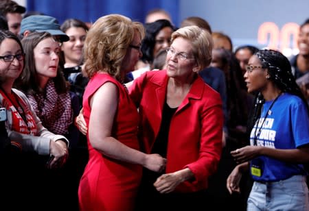 U.S. Democratic presidential candidate Senator Warren (D-MA) embraces former Arizona Congresswoman Giffords after speaking at a forum held by gun safety organizations the Giffords group and March For Our Lives in Las Vegas