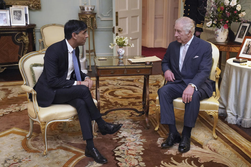 King Charles III, and Britain's Prime Minister Rishi Sunak talk during their meeting at Buckingham Palace, London, Wednesday, Feb. 21, 2024. (Jonathan Brady/Pool Photo via AP)