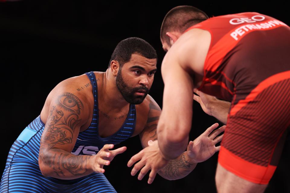 American Gable Steveson, left, competes against Geno Petriashvili of Georgia during the gold-medal match in men’s freestyle wrestling 125kg at the Tokyo Olympics.