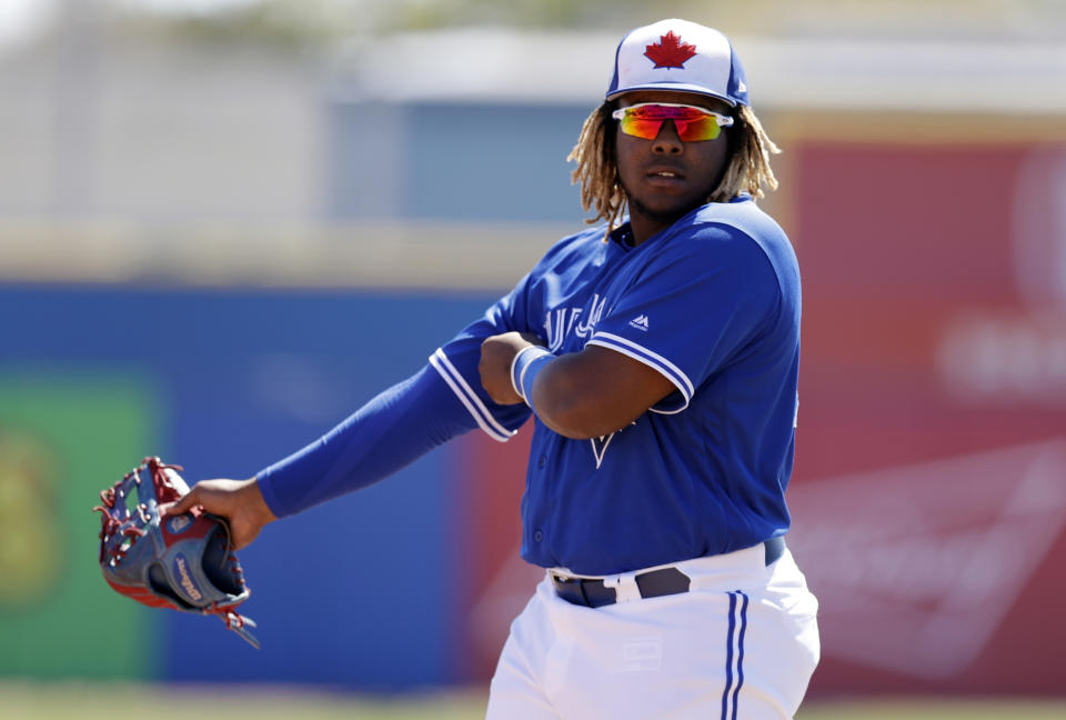 FILE - In this March 6, 2019, file photo, Toronto Blue Jays third baseman Vladimir Guerrero Jr. watches during the second inning of a spring training baseball game against the Philadelphia Phillies in Dunedin, Fla. The Blue Jays top prospect says he feels ready to finally make the jump to the majors, while adding the decision is out of his control. Blue Jays assistant general manager Joe Sheehan said this week the team is still evaluating when to make the move. (AP Photo/Chris O'Meara, File)