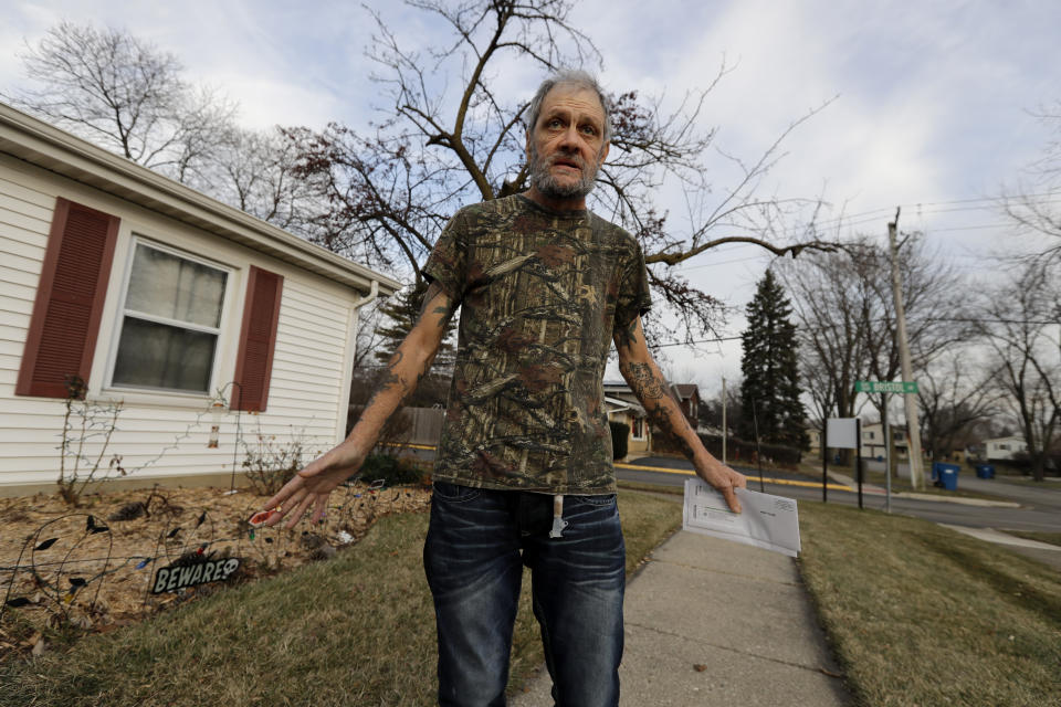In this Friday, Dec. 20, 2019 photo, Bobby Goldberg walks in front of his home in suburban Chicago. Goldberg has filed a lawsuit claiming he was abused more than 1,000 times in multiple states and countries by the late Donald McGuire, a prominent American Jesuit priest who had close ties to Mother Teresa. (AP Photo/Nam Y. Huh)