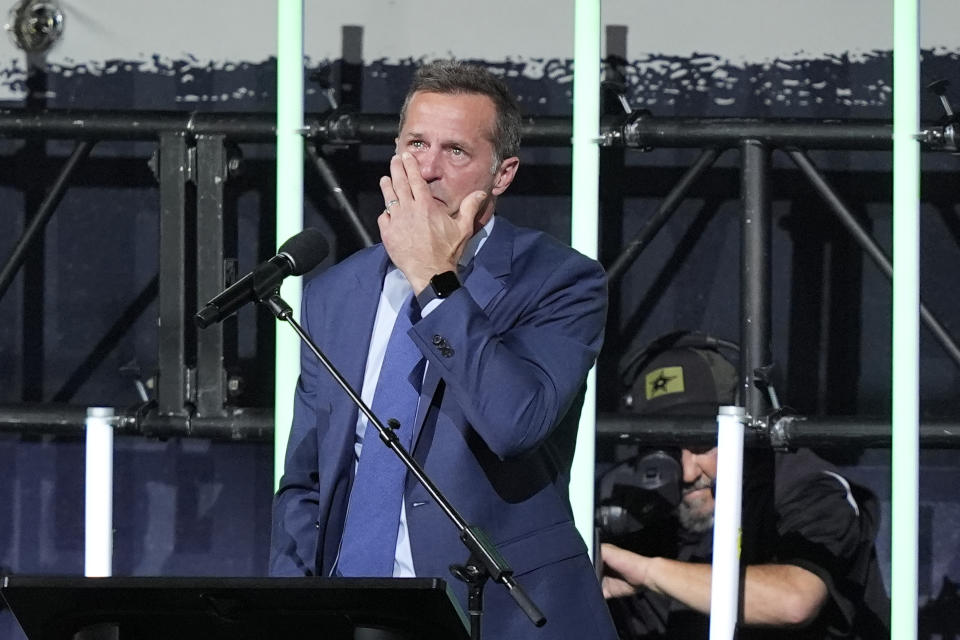 Former Dallas Stars player Mike Modano reacts as he speaks before the unveiling of his statue after the first period an NHL hockey game between the Los Angeles Kings and the Stars in Dallas, Saturday, March 16, 2024. The ceremony was moved inside due to rain. (AP Photo/LM Otero)