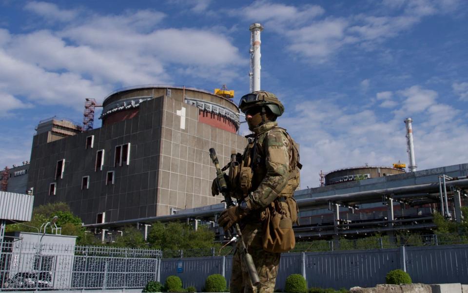 Russian serviceman patrols the territory of the Zaporizhzhia nuclear power plant - AFP