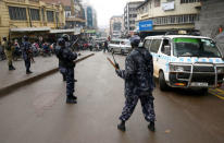 Ugandan riot policemen disperse activists led by musician turned politician, Robert Kyagulanyi, during a demonstration against new taxes including a levy on access to social media platforms in Kampala, Uganda July 11, 2018. REUTERS/Newton Nambwaya