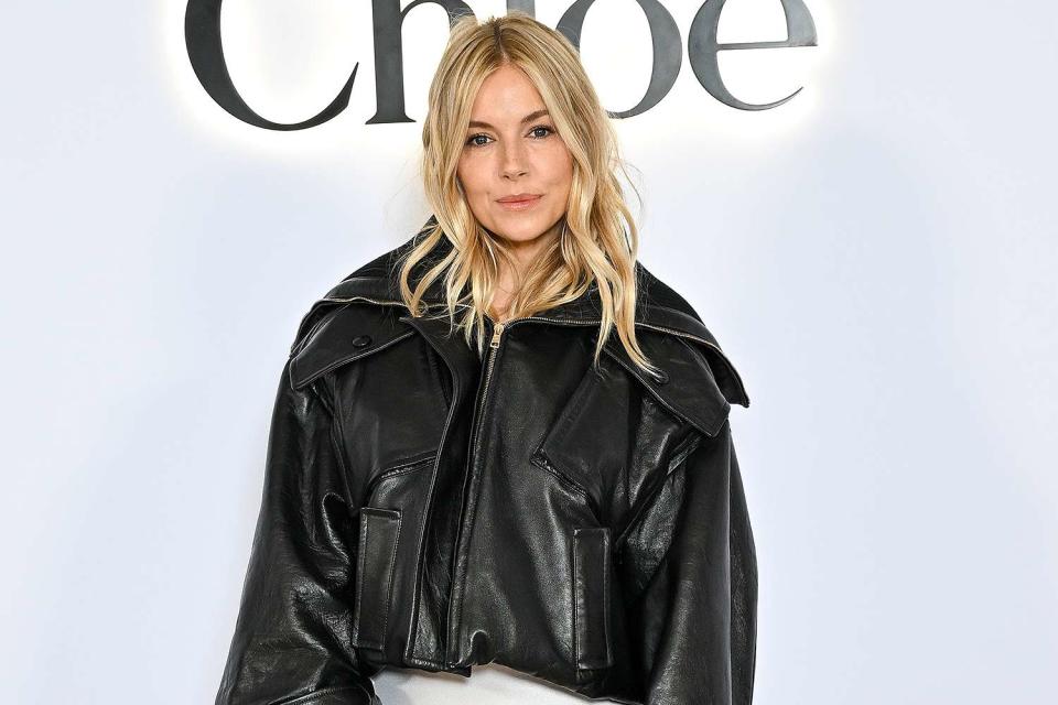 <p>Stephane Cardinale/Getty</p> Sienna Miller makes first public post-pregnancy appearance at the Chloé show during Paris Fashion Week