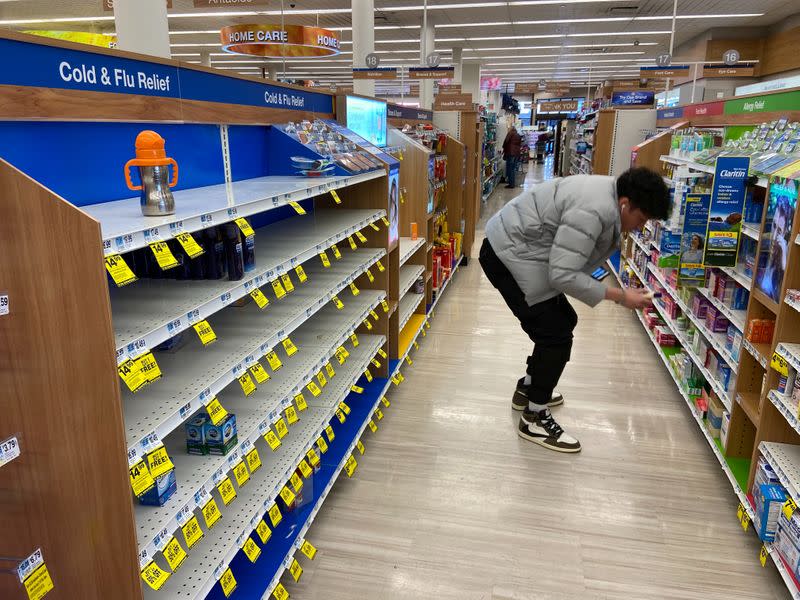 Mainly empty shelves in the cold/flu section, amid fears of the global growth of coronavirus cases, are seen in a Rite Aid store in Greenpoint, Brooklyn, New York