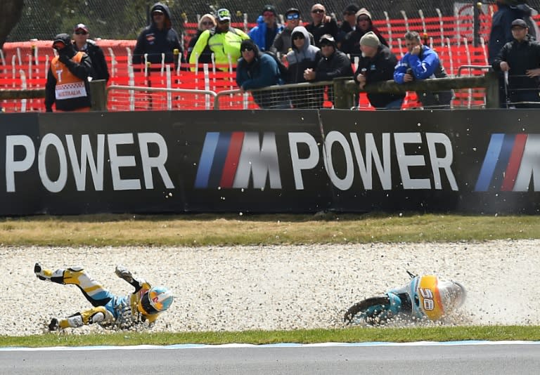 Spanish rider Juanfran Guevara crashes during the qualifying session of the Moto3 class at the Australian Grand Prix on October 22, 2016