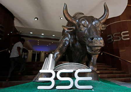 The Bombay Stock Exchange (BSE) logo is seen under a bull statue at the entrance of their building in Mumbai, January 30, 2018. REUTERS/Shailesh Andrade/Files