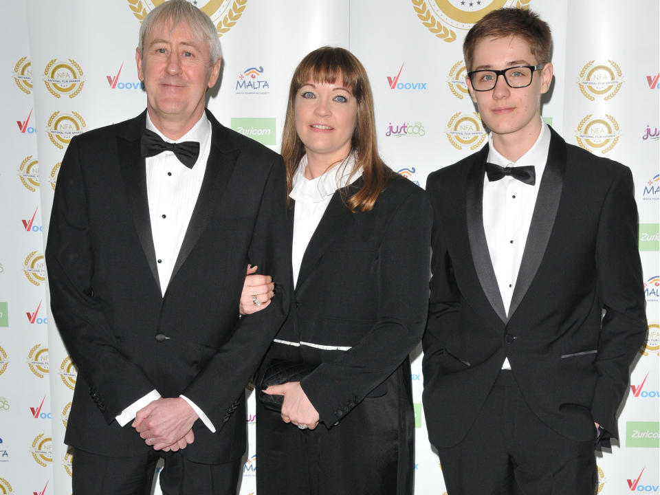 <p>Archie (far right) with his father Nicholas Lyndhurst and mother Lucy Smith in 2017</p> (Rex Features)