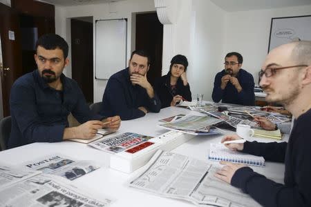 Baris Ince, (2nd L) editor of the left-wing Birgun newspaper attends a news meeting at Birgun newspaper in Istanbul, March 11, 2016. REUTERS/Osman Orsal