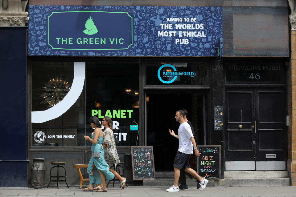 Pedestrians walk past the Green Vic, which is aiming to be the world's most ethical pub, in Shoreditch, London, Britain July 5, 2019. Picture taken July 5, 2019. REUTERS/Simon Dawson