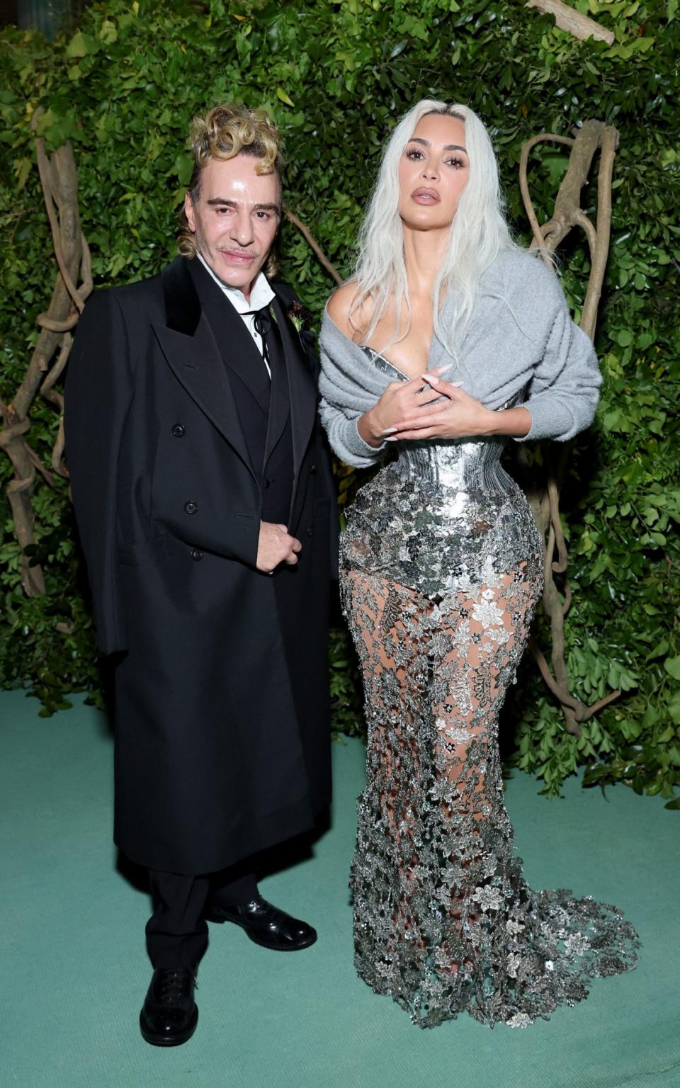 John Galliano made a brief appearance to pose next to Kim Kardashian