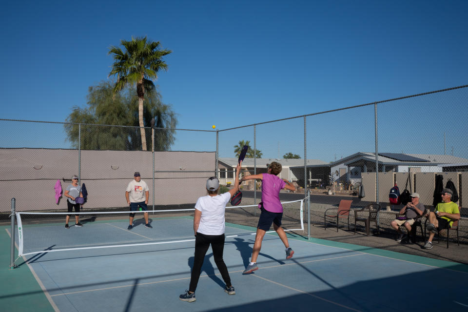 Maggie Lowndes, left, and Karen Burnham play pickleball at Coyote Ranch. Lowndes and Burnham have each lived at Coyote Ranch for six years. (Caitlin O'Hara for The Washington Post)