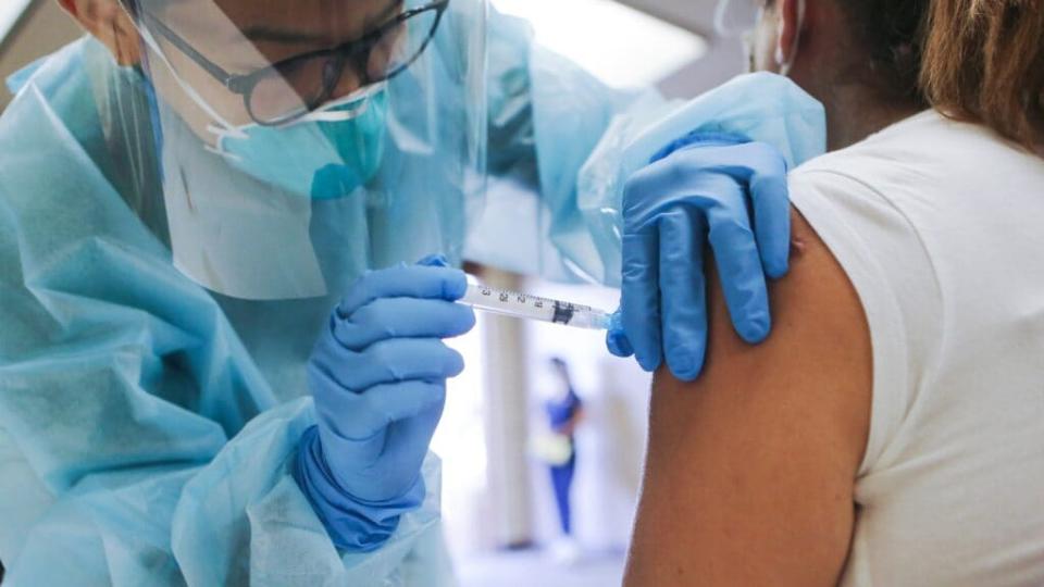 A nurse administers a flu vaccination shot at a recent free clinic in Lakewood, California. Medical experts hope the flu shot this year will help prevent a “twindemic,” an epidemic of influenza paired with a second wave of COVID-19, which could lead to overwhelmed hospitals. (Photo by Mario Tama/Getty Images)