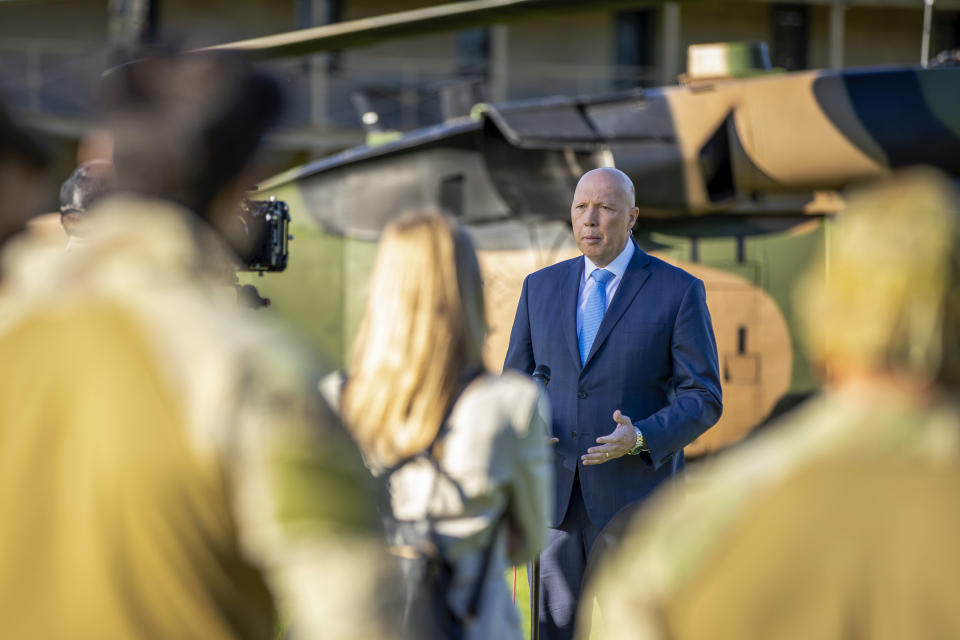 In this photo released by the Australian Department of Defence, Australian Minister of Defence, Peter Dutton addresses a news conference at Victoria Barracks, Sydney, Friday, Dec. 10, 2021. Australia's military said Friday, Dec. 10, 2021, it plans to ditch its fleet of European-designed Taipan helicopters and instead buy U.S. Black Hawks and Seahawks choppers because the American machines are more reliable. (Cpl. Dustin Anderson/Department of Defence via AP)