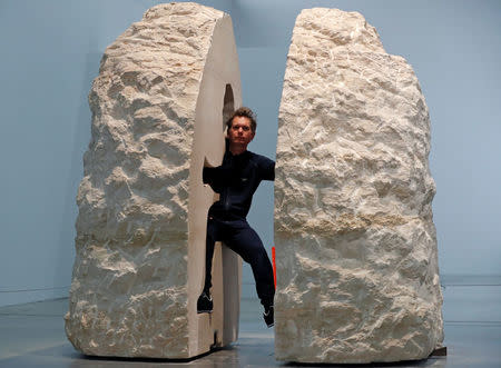 French artist Abraham Poincheval poses inside his artwork Pierre ("Stone") in Paris, France, February 22, 2017, before entering the rock as part of his project to live inside for a week. REUTERS/Christian Hartmann