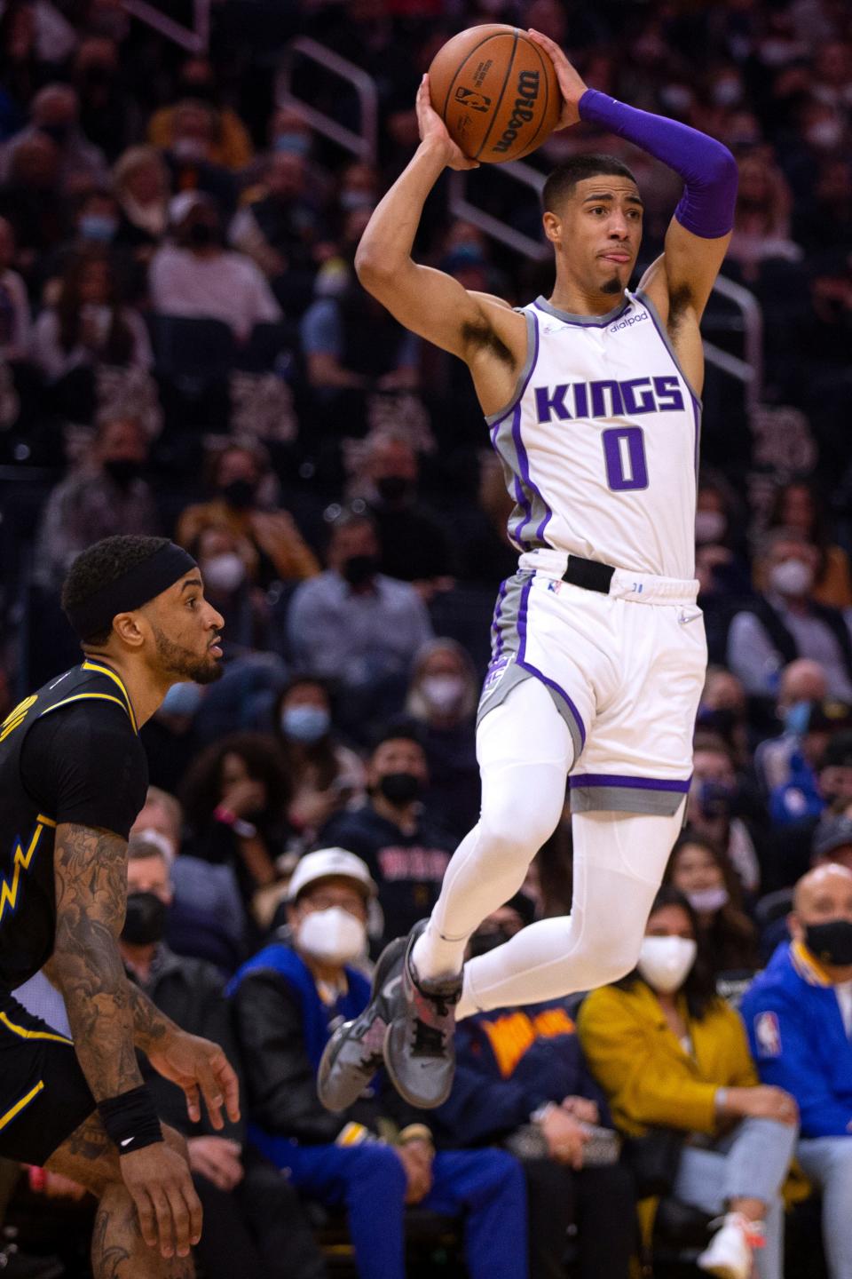 Sacramento Kings guard Tyrese Haliburton (0) looks to pass the ball away from Golden State Warriors guard Gary Payton II during the first quarter of an NBA basketball game Thursday, Feb. 3, 2022, in San Francisco. (AP Photo/D. Ross Cameron)