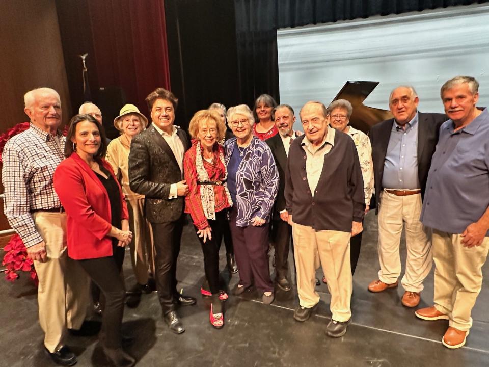 Maximo Marcuso poses with PS Concerts board members Mike Mulcahy, Iliana Rose, Chris Seidel, Barbara Villani, Elizabeth Press, Eula Harris, Ruth Messenger, Angela Greenwood, Stan Deller, Jim Berry, Diane Tasse, Ken LaConde and Jack Lucas.