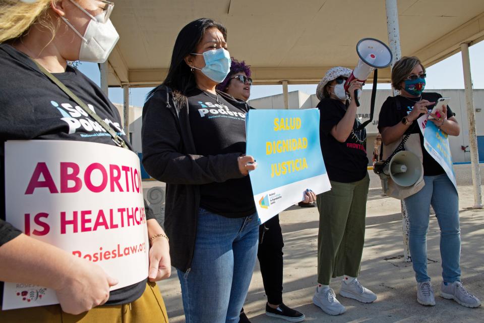 Protesters stand outside the Starr County Jail after Lizelle Herrerra, 26, was charged with murder for allegedly performing what authorities called a "self-induced abortion", in Rio Grande City, Texas, U.S. April 9, 2022. REUTERS/Jason Garza