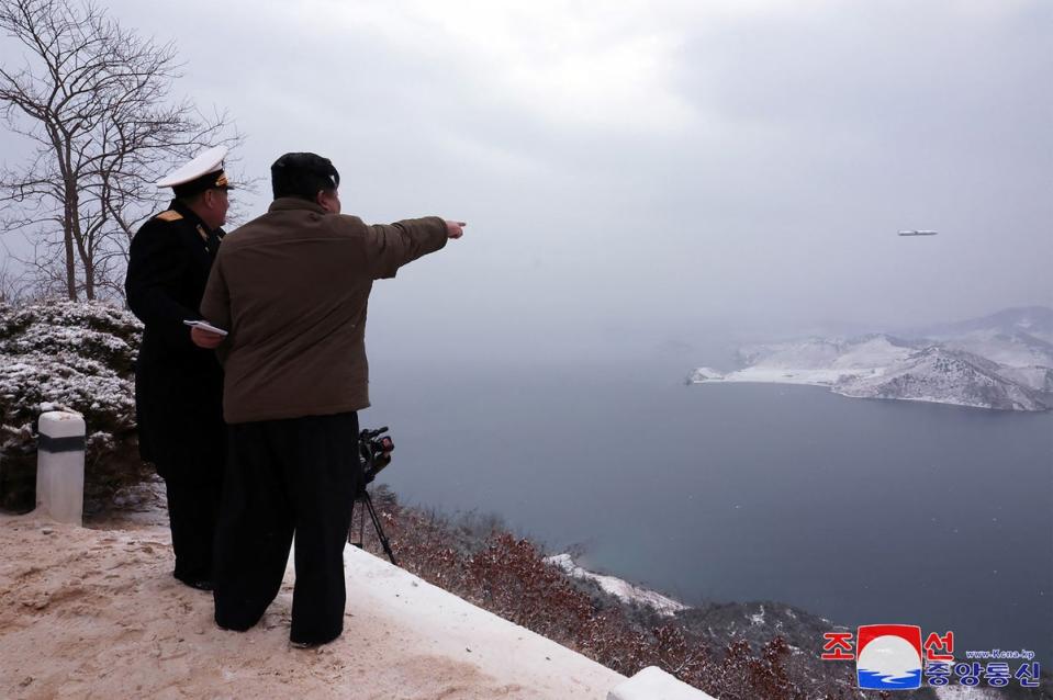 Kim Jong Un reacts to the launch of a Pulhwasal-3-31 missile (Getty)