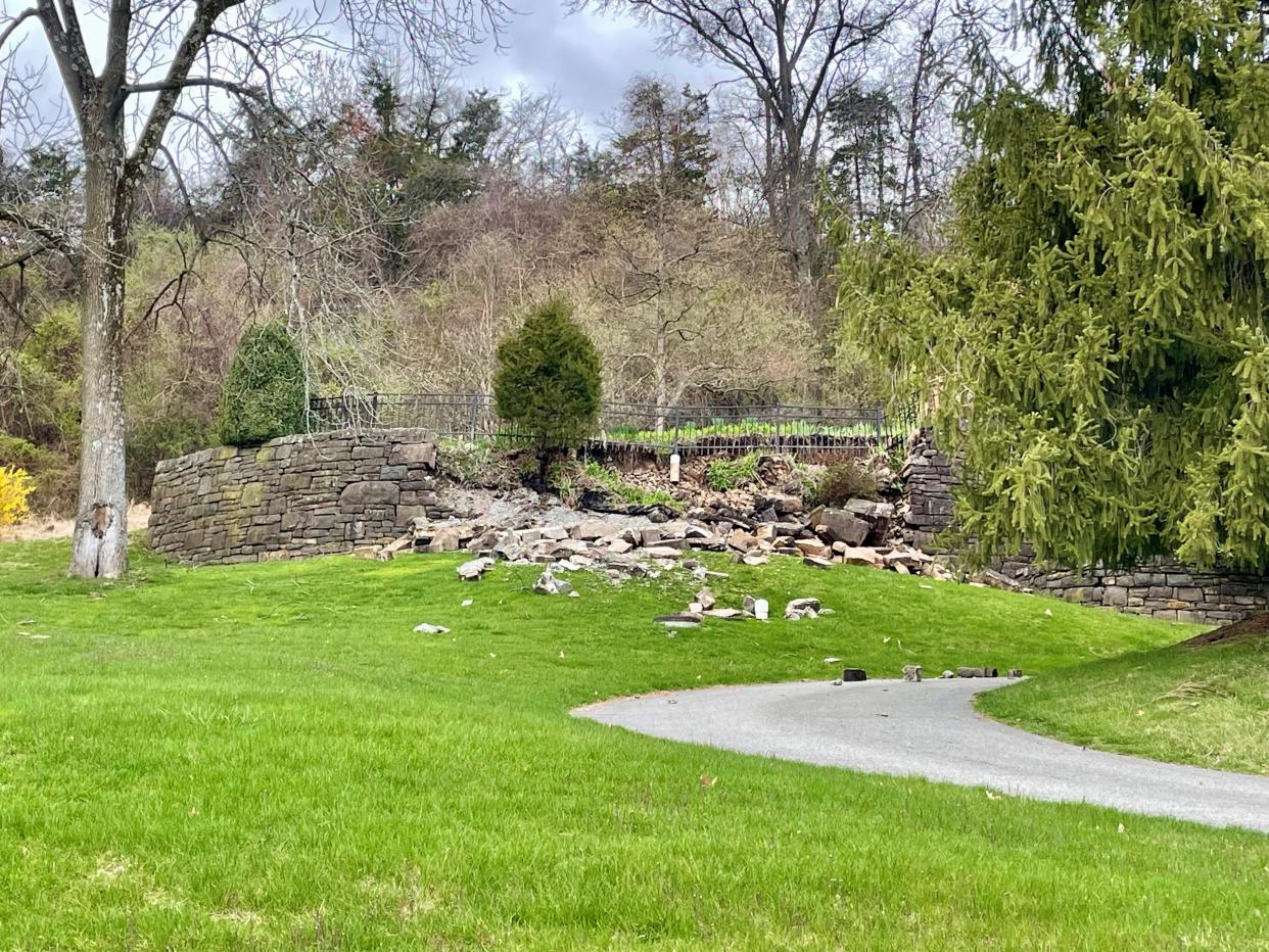 A retaining wall fell in a residential neighborhood off Round Top Road in Tewksbury as a result of the earthquake on Friday, April 5, 2024.