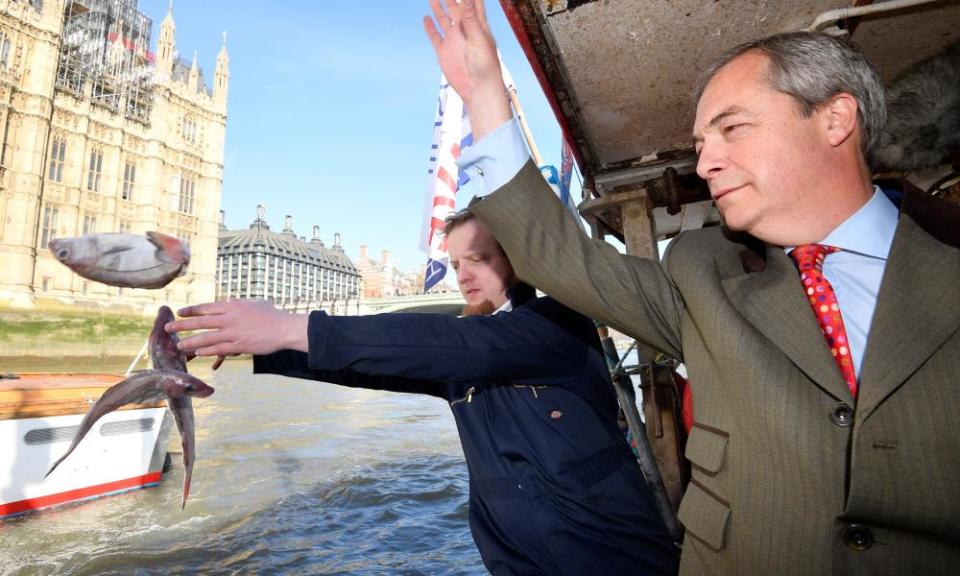 So long, and thanks for all the fish: Nigel Farage and the founder of Fishing for Leave discard fish next to the Houses of Parliament.