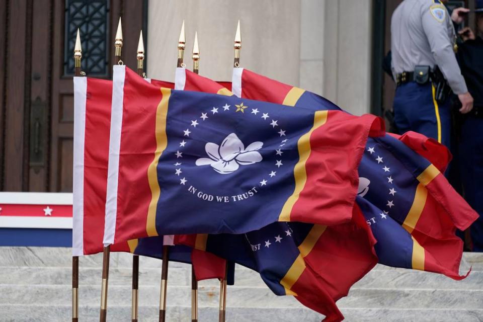 A bank of Mississippi State flags wave during the inauguration of Mississippi Republican Gov. Tate Reeves at the Mississippi State Capitol in Jackson earlier this month. Rogelio V. Solis/AP