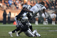 <p>Melvin Gordon #28 of the Los Angeles Chargers is tackled by Karl Joseph #42 of the Oakland Raiders during their NFL game at Oakland-Alameda County Coliseum on November 11, 2018 in Oakland, California. (Photo by Thearon W. Henderson/Getty Images) </p>