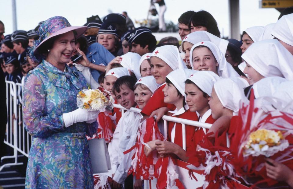 Queen Elizabeth II meeting a group of Red Cross students