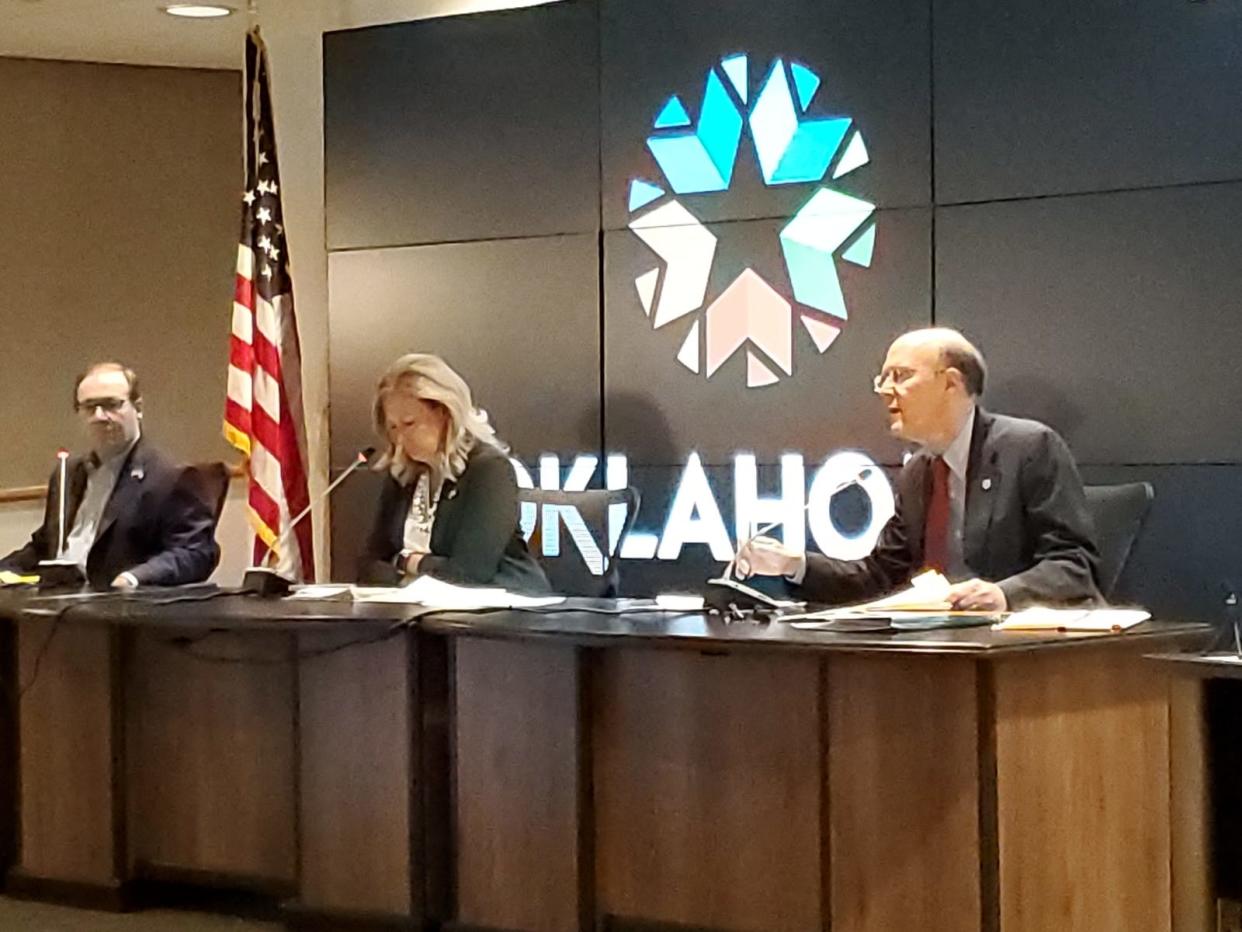 Corporation Commissioner Bob Anthony, right, addresses Commissioners Todd Heitt and Kim David during a July 23 meeting.