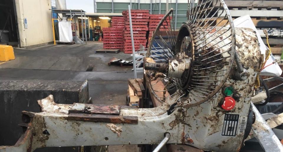 Broken cake or dough mixer at recycling station