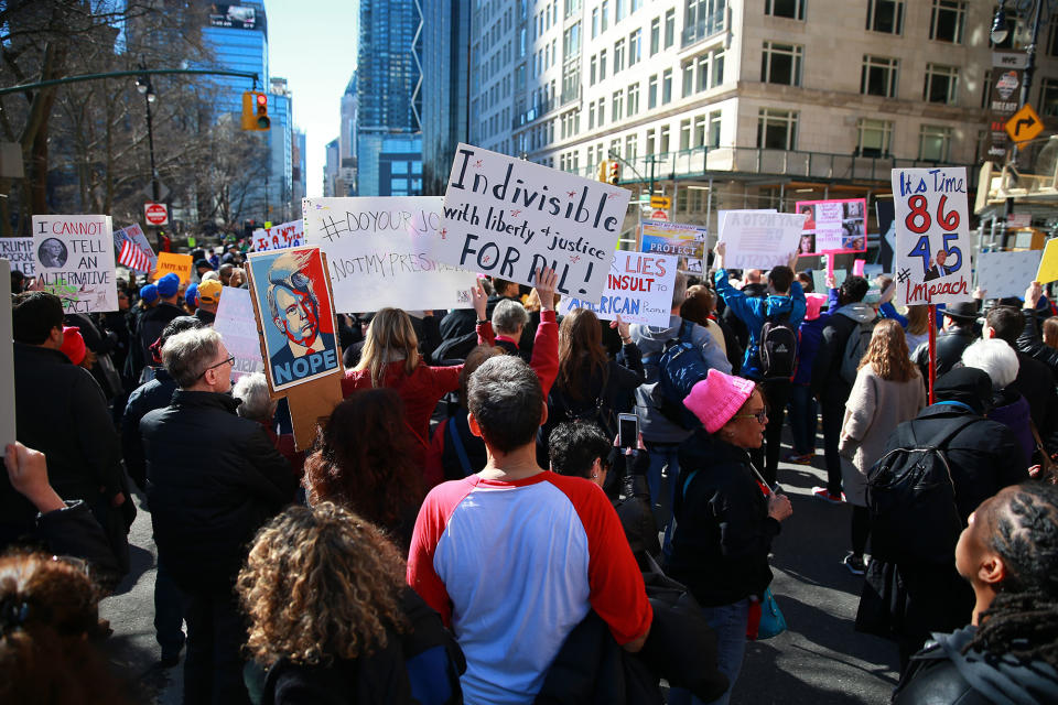 <p>Demonstrators holds up signs during the “Not My President’s Day” rally at Central Park West in New York City on Feb. 20, 2017. (Gordon Donovan/Yahoo News) </p>