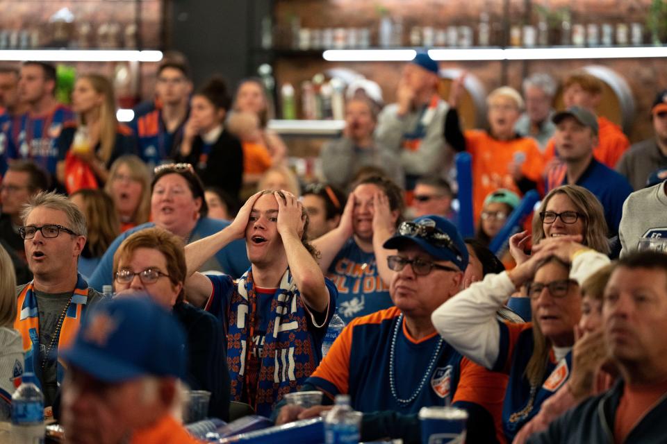 Jack Bolander reacts to FC Cincinnati having a scoring attempt at the FC Cincinnati and New York Red Bulls MLS playoff match watch party inside TQL Stadium in Cincinnati on Saturday, Oct. 15, 2022. 