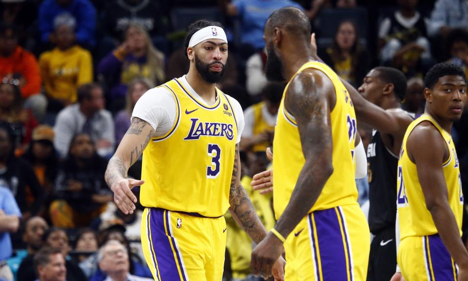 Apr 12, 2024; Memphis, Tennessee, USA; Los Angeles Lakers forward Anthony Davis (3) reacts with forward LeBron James (23) during the second half against the Memphis Grizzlies at FedExForum. Mandatory Credit: Petre Thomas-USA TODAY Sports