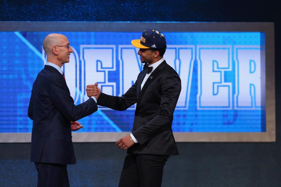 <p>NEW YORK, NY – JUNE 23: Jamal Murray shakes hands with Commissioner Adam Silver after being drafted seventh overall by the Denver Nuggets in the first round of the 2016 NBA Draft at the Barclays Center on June 23, 2016 in the Brooklyn borough of New York City. (Photo by Mike Stobe/Getty Images) </p>
