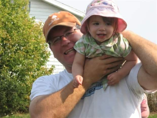 Taylor is pictured here with his daughter, who was 13 years old when her father died.