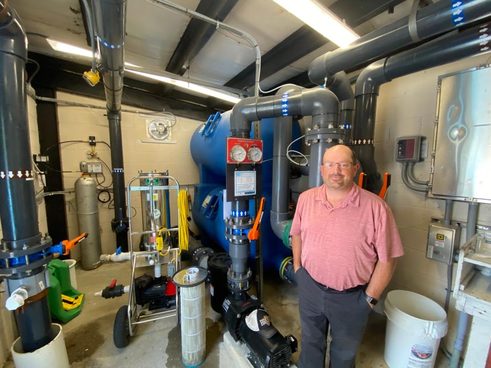 AJ Marshall, Taunton's commissioner of Parks, Cemeteries and Public Grounds, shows off new equipment in the mechanical room at Hopewell Pool on Thursday, July 22, 2021. This system changes out the pool two hours faster than the previous equipment.