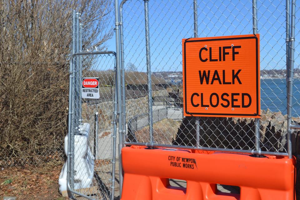 Signs and fencing warn walkers about continuing on the Cliff Walk at Webster Avenue.