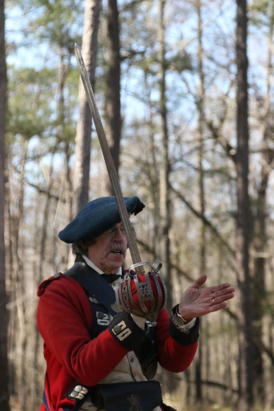 Living historian portraying a Scottish Highlander demonstrating the sword tactics used by the Scots during the Battle of Moores Creek Bridge.
