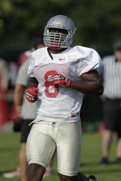 Ohio State defensive lineman Noah Spence warms up during an NCAA college football practice Saturday, Aug. 9, 2014, in Columbus, Ohio. (AP Photo/Jay LaPrete)