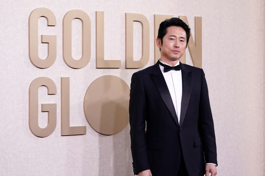 Steven Yeun arrives at the 81st Golden Globe Awards on Sunday, Jan. 7, 2024, at the Beverly Hilton in Beverly Hills, Calif. (Photo by Jordan Strauss/Invision/AP)