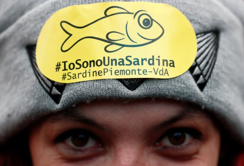 Protesters attend a demonstration held by "the sardines", a grassroots movement against far-right League leader Matteo Salvini, in Bologna