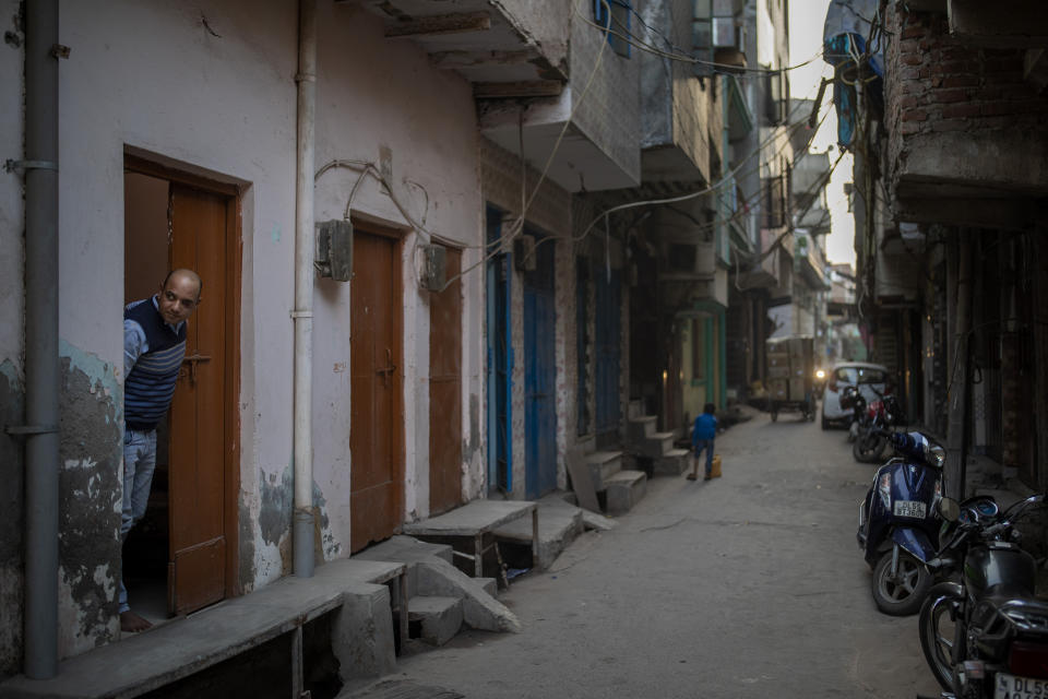 Muhammad Nasir Khan, who was shot by a Hindu mob during the February 2020 communal riots, looks out from his home in North Ghonda, one of the worst riot affected neighborhood, in New Delhi, India, Friday, Feb. 19, 2021. As the first anniversary of bloody communal riots that convulsed the Indian capital approaches, Muslim victims are still shaken and struggling to make sense of their struggle to seek justice. (AP Photo/Altaf Qadri)