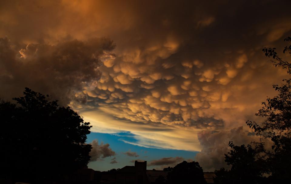 Mammatus clouds, pouches that form on the lower surface of cumulonimbus clouds, fill the sky over Wooster Wednesday night around the same time the area was under a tornado warning.