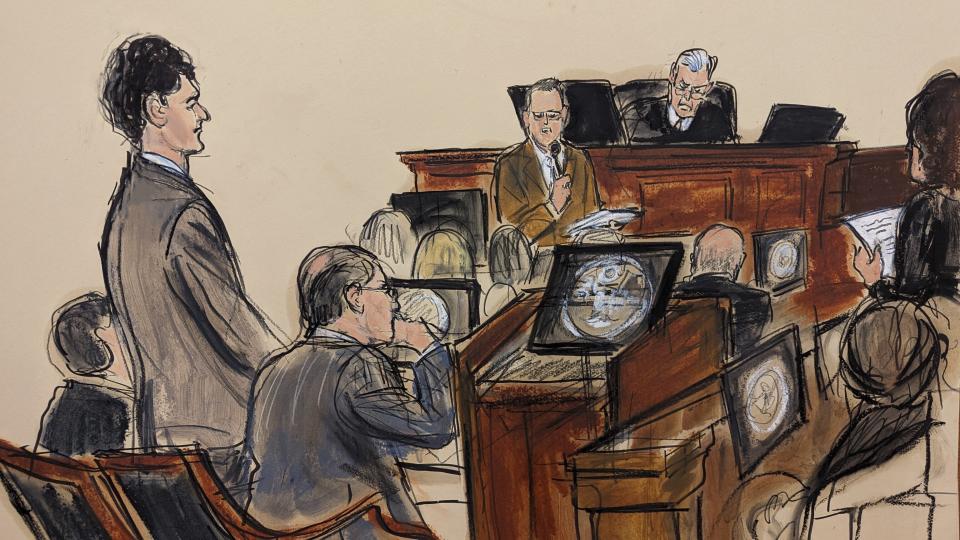 In this courtroom sketch, Sam Bankman-Fried, far left, stands as the jury foreperson, standing far right, reads the verdict with Judge Lewis Kaplan presiding on the bench in Manhattan federal court, Thursday, Nov. 2, 2023, in New York. A New York jury has convicted FTX founder Sam Bankman-Fried of fraud charges. The 31-year-old California man was convicted Thursday in Manhattan federal court by jurors who rejected his testimony that he didn't defraud customers.(Elizabeth Williams via AP)